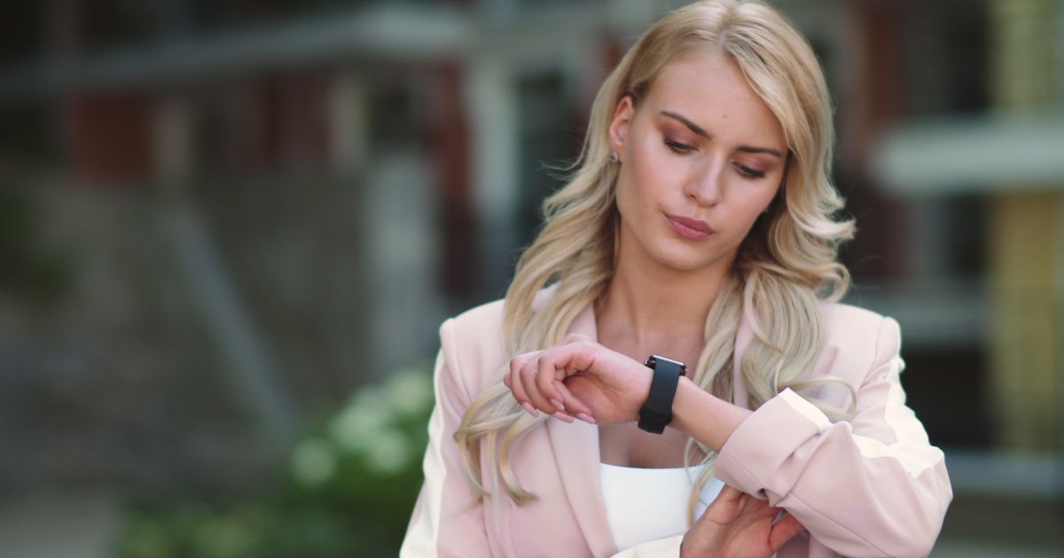 woman looking at her watch